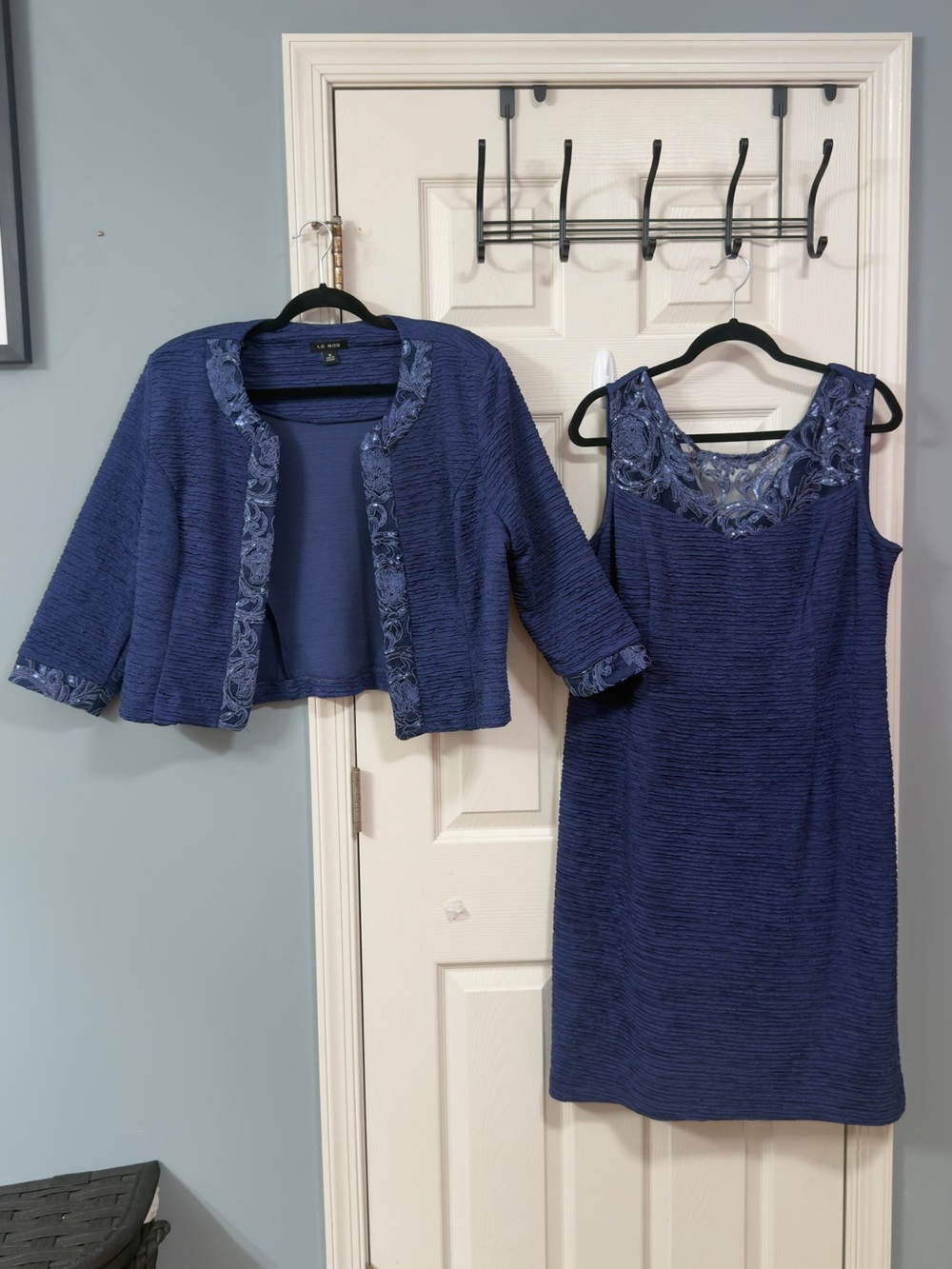 Elegant Navy Blue Midi Dress with Embroidered Neckline and Coordinating Jacket